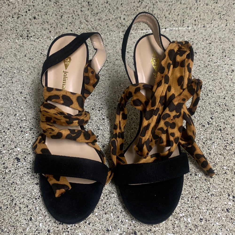 Lace up black and leopard sandal.